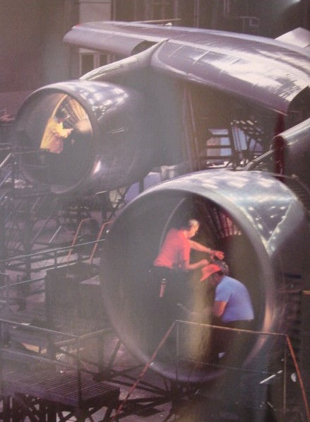 1980s Mechanics overhal two engines on a Boeing 747 at Pan Am's Jet Center maintenance base at JFK Airport in New York.